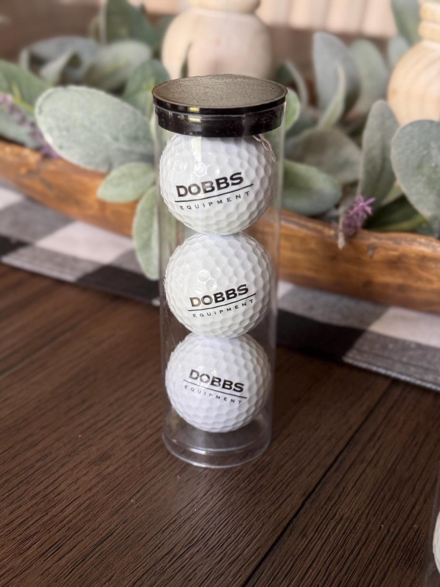 Three custom logo golf balls printed in full colour in a clear presentation tube
