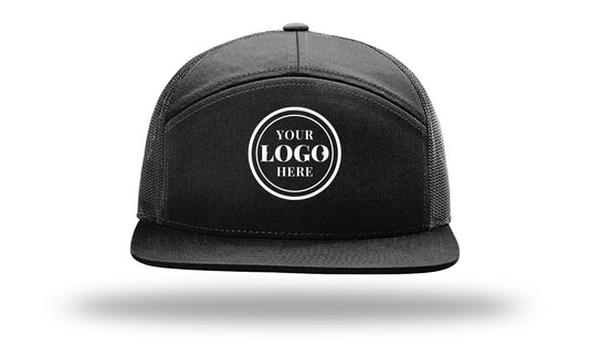 Richardson 168 seven-panel trucker cap, black, with 2.1 in embroidered logo placeholder